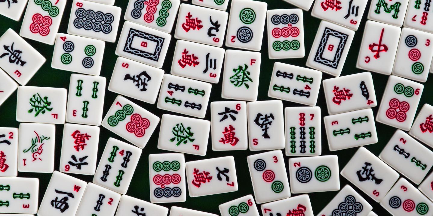 Colorful game tiles with symbols on them.