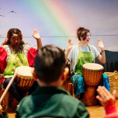 Group of people playing African drums