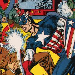 A comic book cover with super hero Captain America punching Hitler in the face.