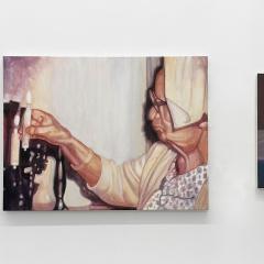 Three paintings on a gallery wall depicting candles with the one in the middle a person lighting one.