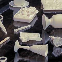 Everyday objects made of white resin like cups and scissors
